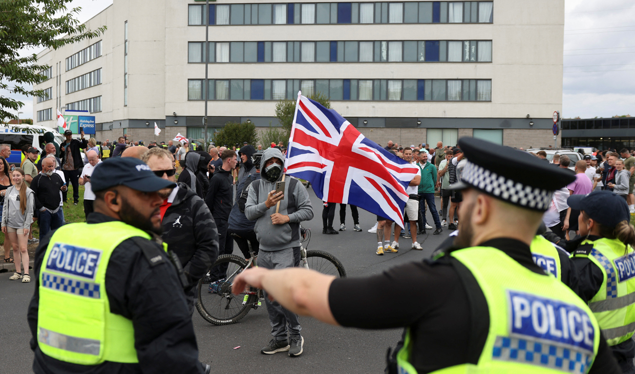 In this file photo, taken on August 4, 2024, police officers operate outside a hotel during an anti-immigration protest, in Rotherham, Britain. (REUTERS)