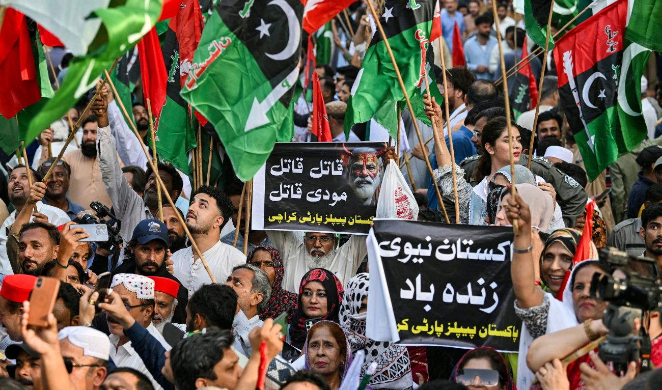 Supporters of Pakistan Peoples Party (PPP) hold Pakistani flags and placards as they protest against India in Karachi on May 7, 2025. (AFP)