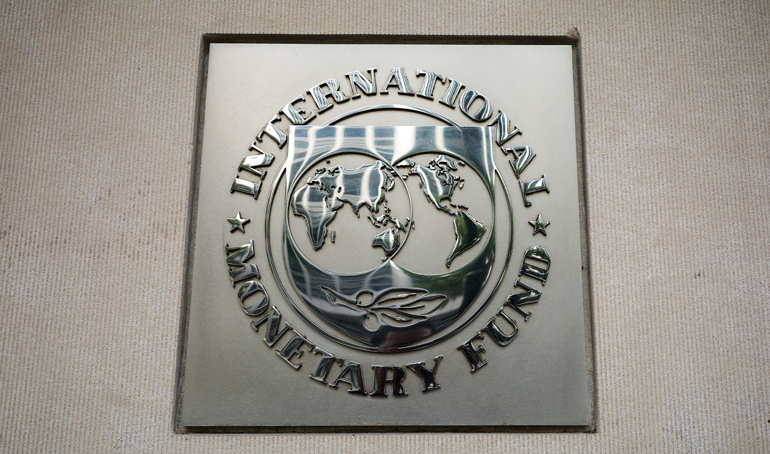 The seal of the International Monetary Fund is seen outside of its headquarters in Washington, DC on October 7, 2021. The annual meetings are running from October 11-17, 2021. (AFP/File)