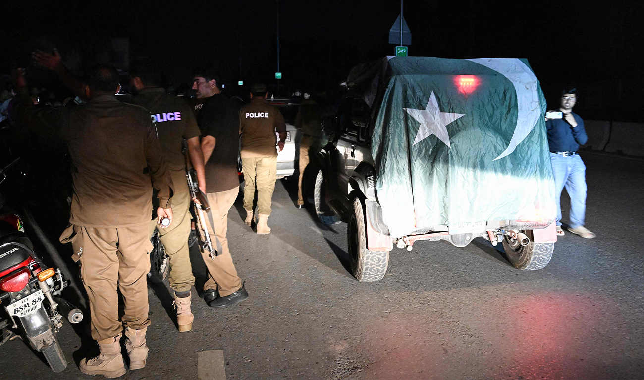 Security personnel cordon off a road near Nur Khan military airbase after Indian strikes in Rawalpindi on May 10, 2025. (AFP)