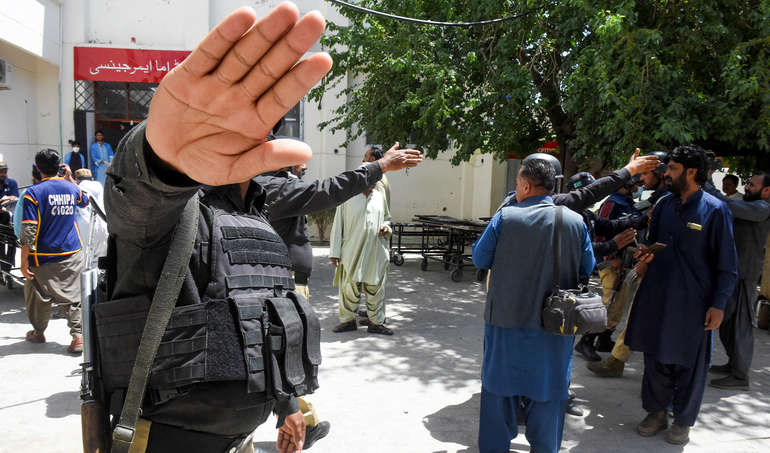 Policemen impede the media as injured security personnel arrive at a hospital in Quetta on April 15, 2025. (AFP/File)