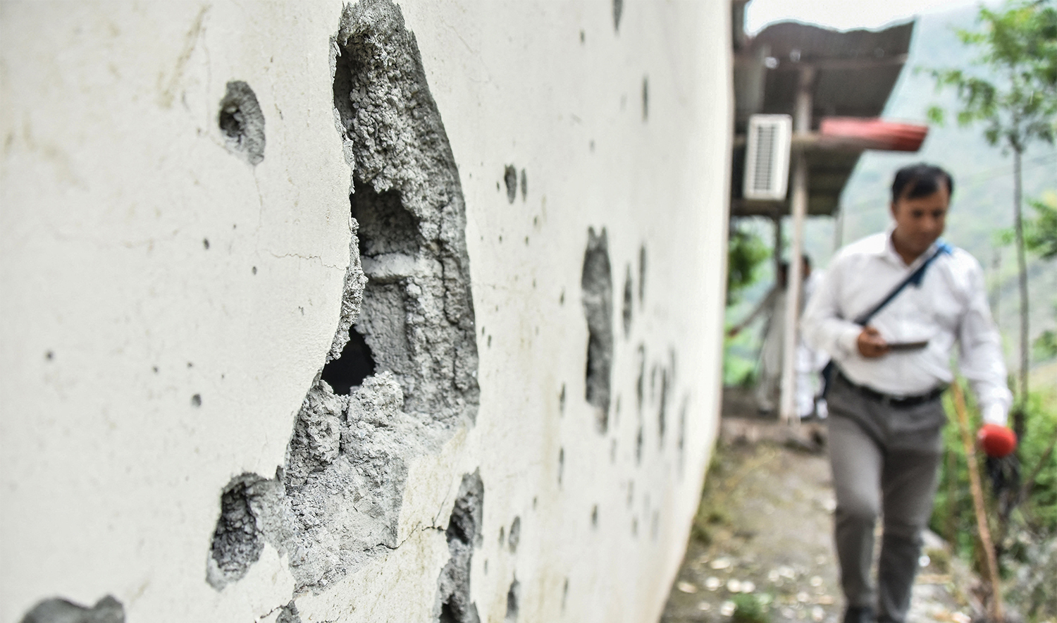 A partially damaged wall of the Neelum Jhelum Hydropower Project is pictured following Indian strikes in Nausari, about 40kms from Muzaffarabad, the capital of Azad Kashmir, on May 8, 2025. (AFP)
