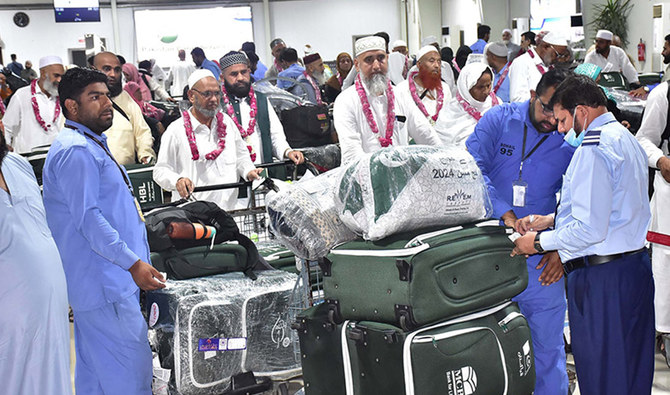 Officials check baggage of Hajj pilgrims as they arrive at the Sialkot International Airport in Sialkot on June 20, 2024. (APP)