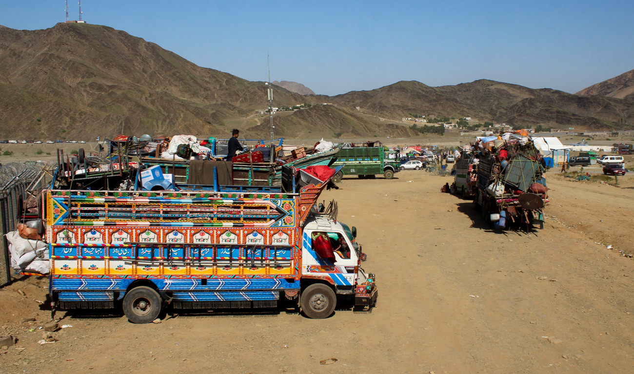 Trucks transporting Afghan nationals, who were expelled from Pakistan, are parked as refugees wait for registration at the Omari refugee camp in Mohmand Dara, Torkham border, Nangarhar province, Afghanistan, on April 15, 2025. (REUTERS/File)