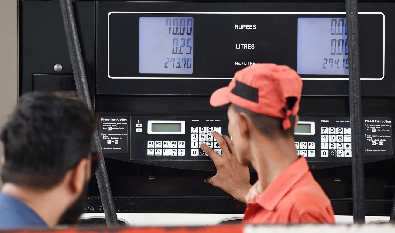 An employee prepares to fill petrol in a vehicle at a fuel station in Karachi on August 1, 2023. (AFP/ file)
