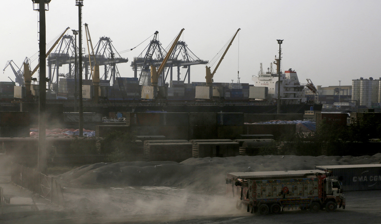 A truck moves past cranes during a media tour of the Karachi Port, Pakistan on May 9, 2025. (REUTERS)
