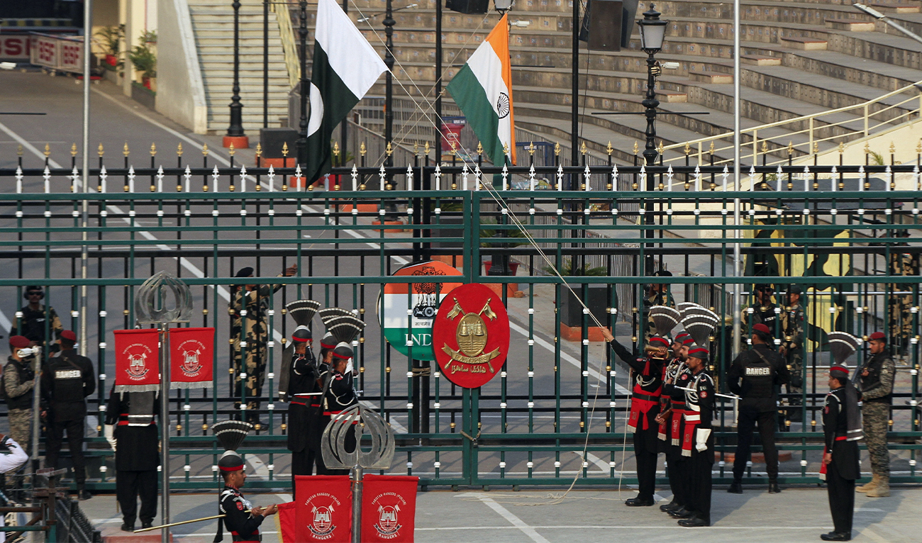 Pakistan Rangers and Indian Border Security Force soldiers lower their national flags at the Pakistan-India joint check post at Wagah border, near Lahore, Pakistan, on May 14, 2025. (REUTERS/File)