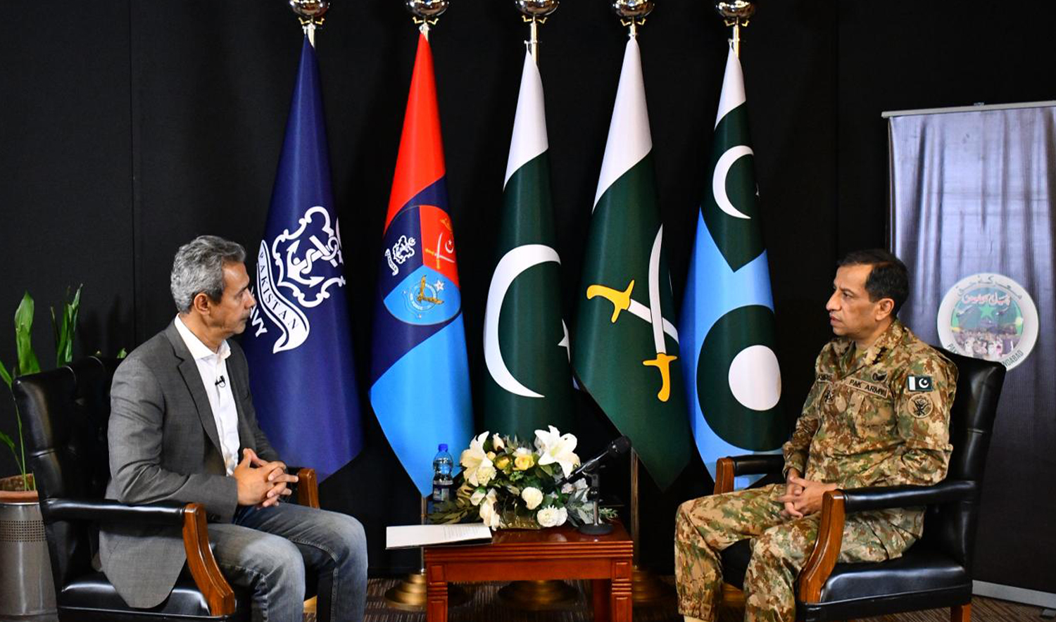 Spokesperson of the Pakistan Armed Forces, Lt. Gen. Ahmed Sharif Chaudhry (right), speaks to Arab News Pakistan in Rawalpindi, Pakistan, on May 16, 2025. (AN photo)