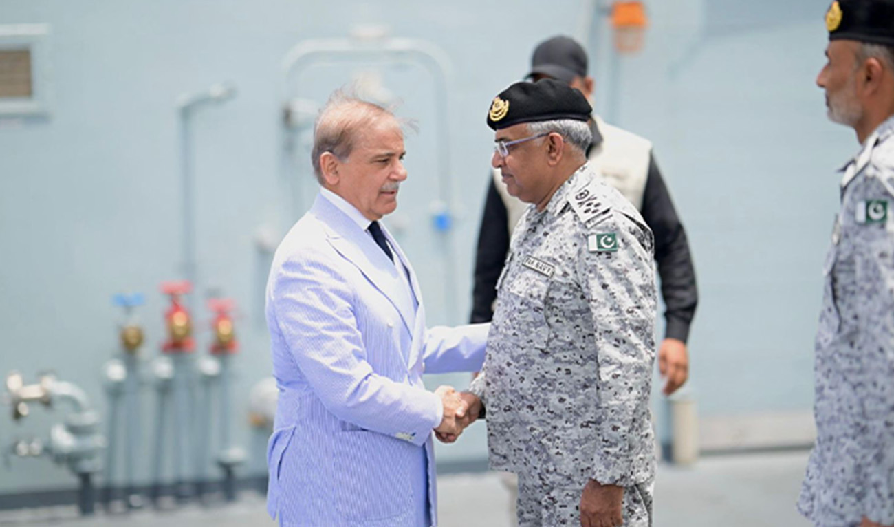 Pakistan's Prime Minister Shehbaz Sharif (left) being received by country's Naval Chief Admiral Naveed Ashraf upon his arrival at Naval Dockyard in Karachi on 19 May 2025. (Government of Pakistan)
