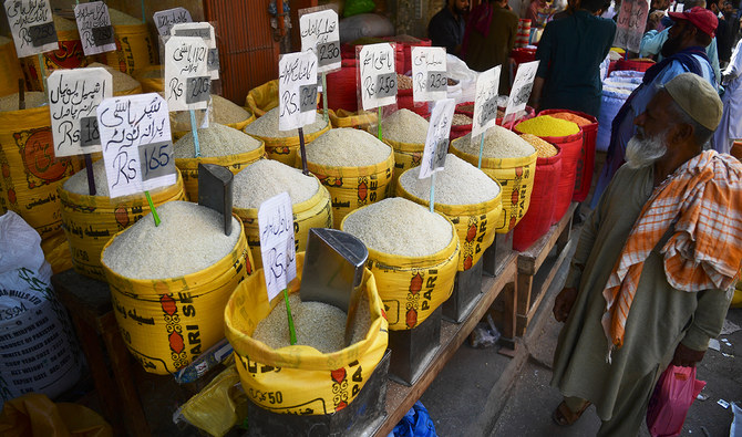 A man looks at rice prices at a market in Karachi on February 3, 2023. (AFP/FILE)