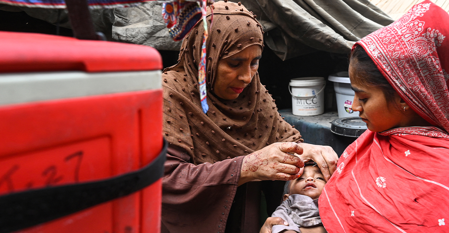 A health worker administers polio drops to a child during a door-to-door vaccination campaign in Lahore on October 28, 2024. (AFP/File)