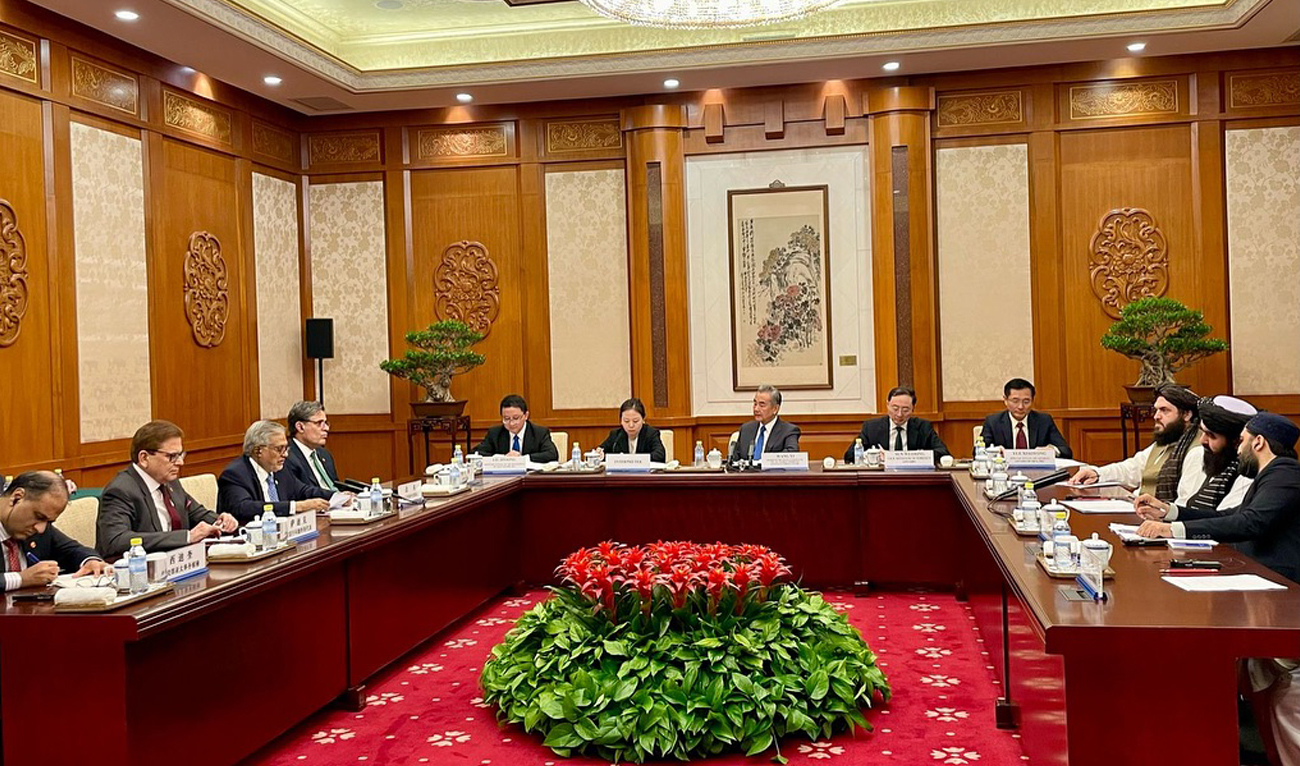 In this handout photo, released by Pakistan’s Foreign Ministry, Pakistan Foreign Minister Ishaq Dar (3L) speaks during an informal trilateral meeting with his counterparts from China, Wang Yi (center), and Afghanistan, Amir Khan Muttaqi (2R), in Beijing, China on May 21, 2025. (Handout/MOFA)