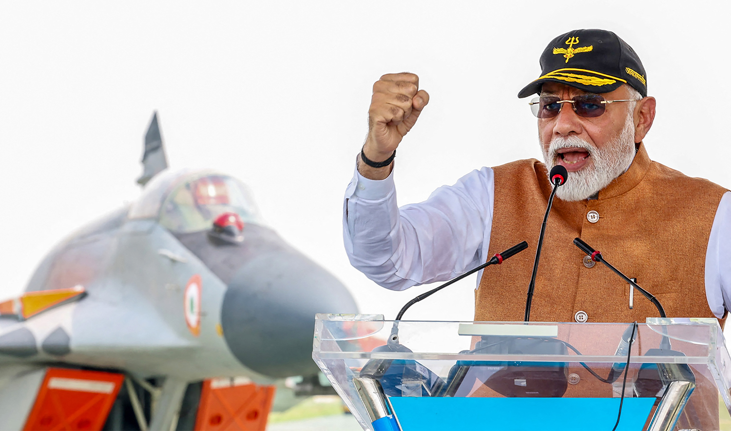 This handout photograph released on May 13, 2025, by the Indian Press Information Bureau (PIB) shows India's Prime Minister Narendra Modi addressing armed force personnel during his visit to Adampur Airforce Base in India's state of Punjab. (Indian Press Information Bureau/AFP)