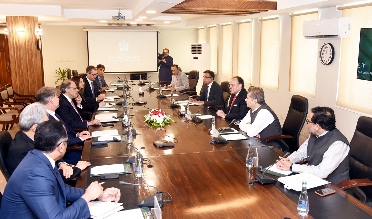 Pakistan Finance Minister Muhammad Aurangzeb (3R) speaks during a meeting with the visiting IMF delegation, led by Jihad Azour (4L), at the Finance Division in Islamabad on May 21, 2025. (Photo courtesy: Handout/Finance Ministry)