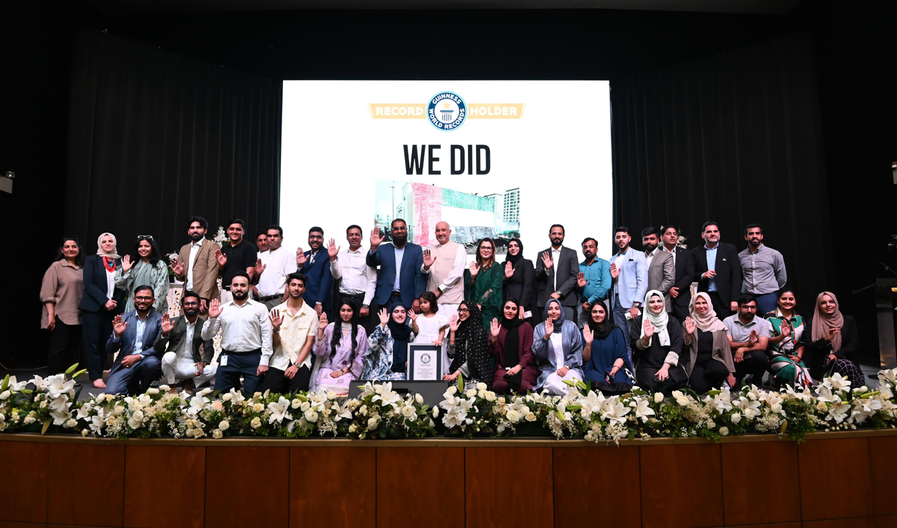 This handout photo, taken and released by Pakistan Embassy in UAE on May 22, 2025, shows Pakistan Ambassador to UAE Faisal Niaz Tirmizi posing for a group photo with officials and participants an event to commemorate a new Guinness World Record in Dubai, UAE. (Handout/Pakistan Embassy)