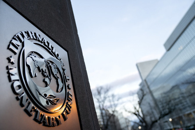 The seal for the International Monetary Fund is seen near the World Bank headquarters (R) in Washington, DC. (AFP/ file)