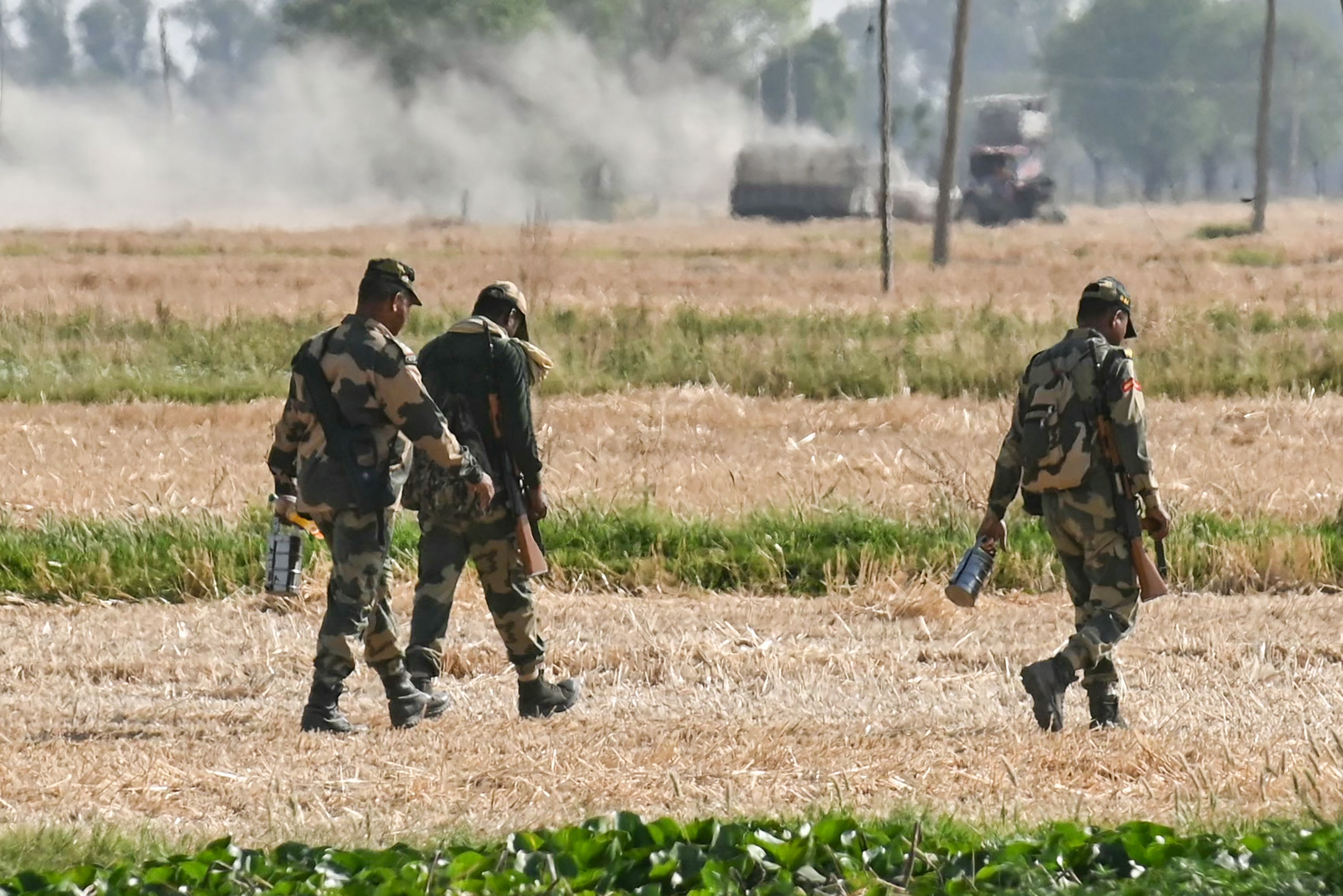 Indian Border Security Force (BSF) soldiers return to their BSF camp near Daoke village, about 45 km from Amritsar, on April 27, 2025. (AFP/File)