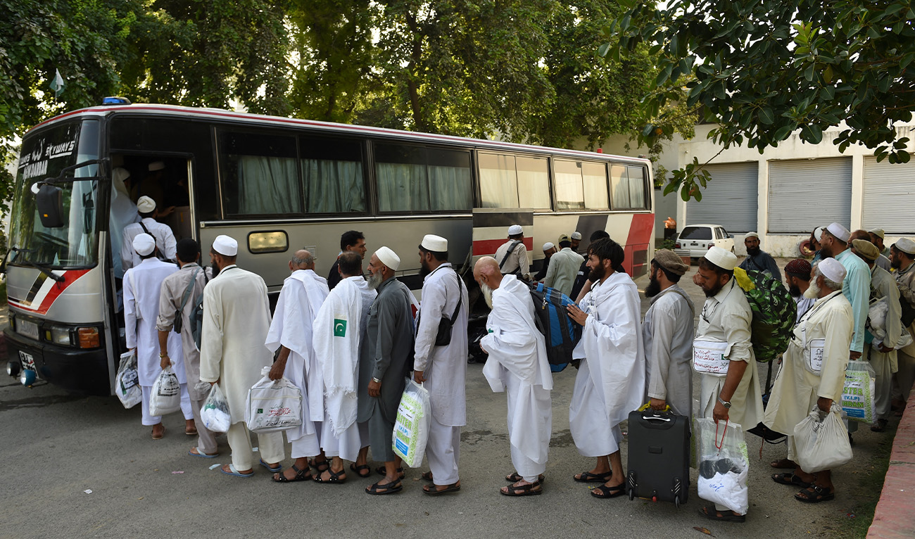 Pakistani Hajj pilgrims queue to embark onto a bus at The Hajj Complex in Islamabad on August 23, 2016, before leaving for the annual Hajj pilgrimage to the Islamic holy cities of Mecca and Medina in Saudi Arabia. (AFP/File)