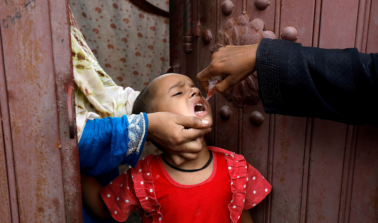 A girl receives polio vaccine drops during an anti-polio campaign in Karachi, Pakistan, July 20, 2020. (Reuters/File)