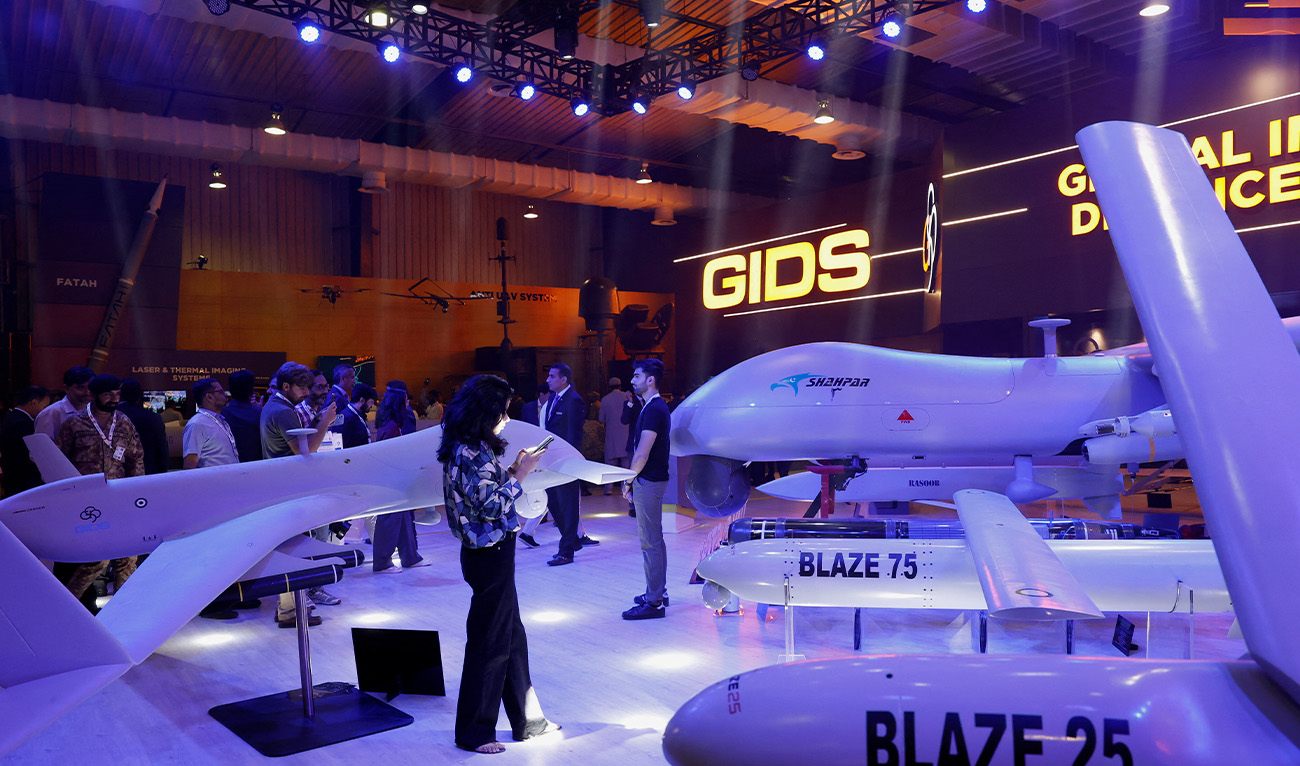 Visitors inspect the Global Industrial & Defence Solutions (GIDS) unmanned combat aerial vehicle (UCAV) Shahpar during the International Defence Exhibition and Seminar (IDEAS 2024) in Karachi, Pakistan, on November 21, 2024. (Reuters/File)