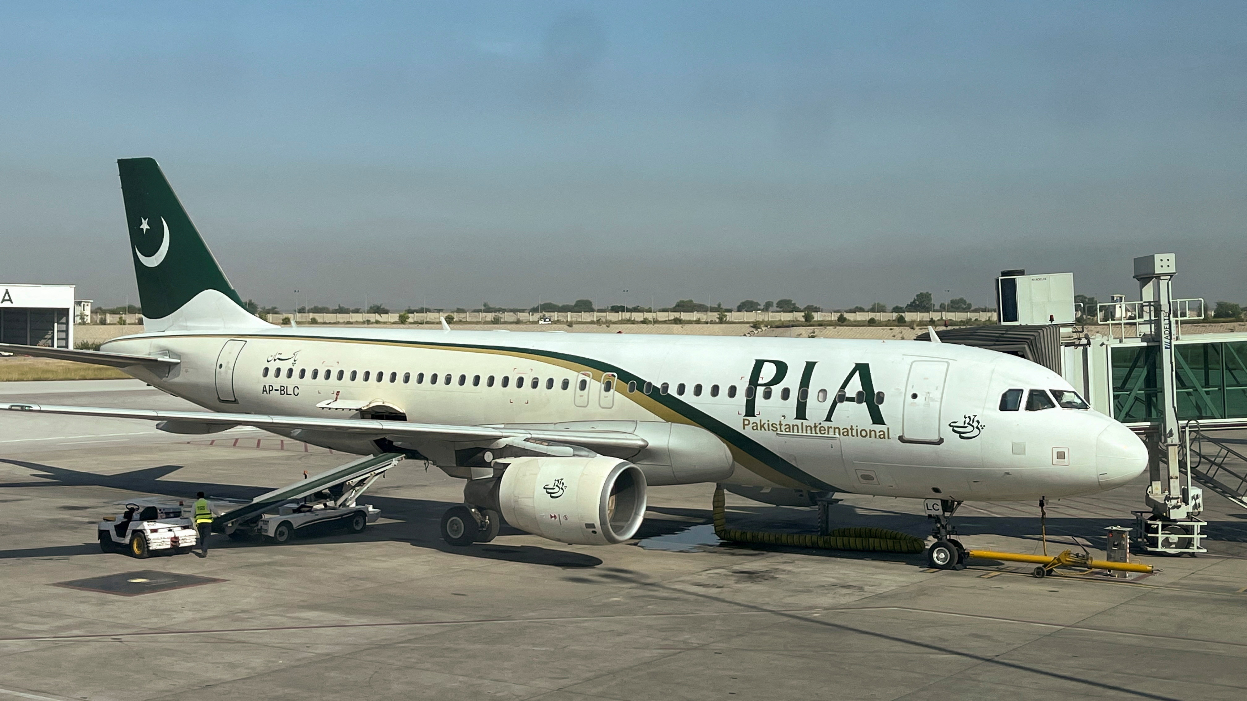 View of a Pakistan International Airlines (PIA) passenger plane, taken through a glass panel, at Islamabad International Airport, in Islamabad, Pakistan, on October 3, 2023. (REUTERS/File)