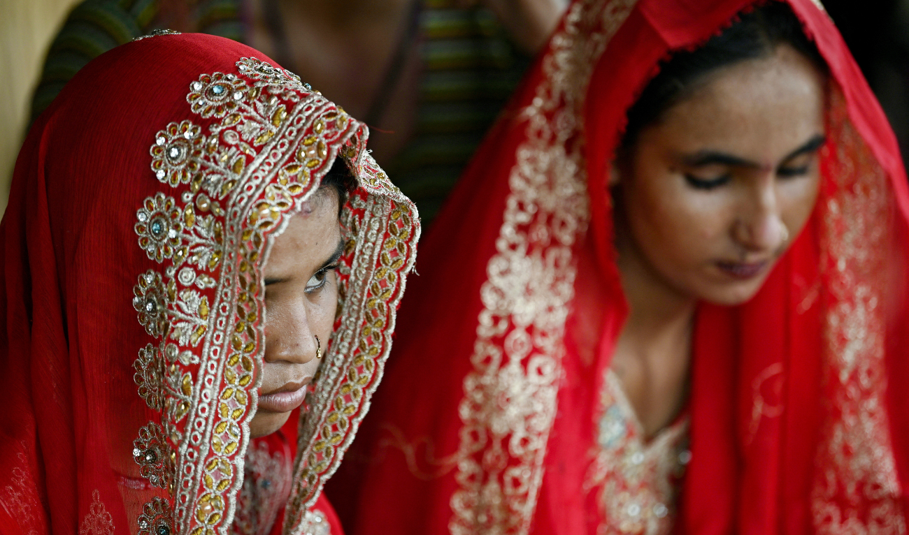 In this photograph taken on August 3, 2024 Shamila (L) and Salma Zameer, monsoon brides who were married underage look on at Khan Muhammad Mallah village, Dadu district in Sindh province. (AFP/ file)