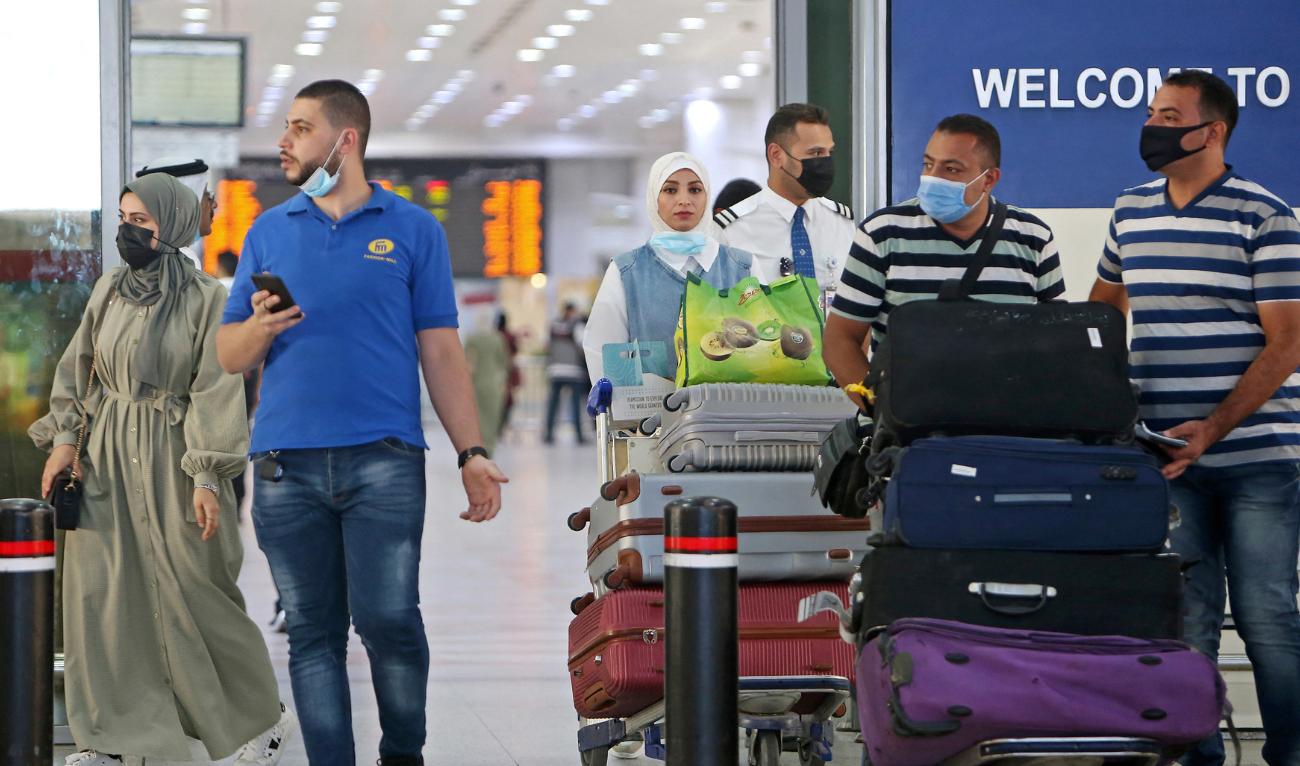 Travelers arrive at Kuwait international airport in Kuwait City on September 5, 2021. (AFP/ file)