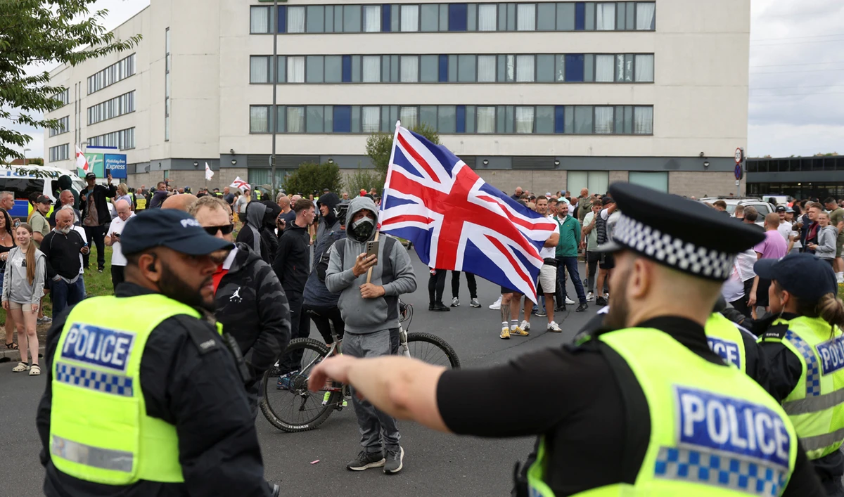 In this file photo, taken on August 4, 2024, police officers operate outside a hotel during an anti-immigration protest, in Rotherham, Britain. (REUTERS)