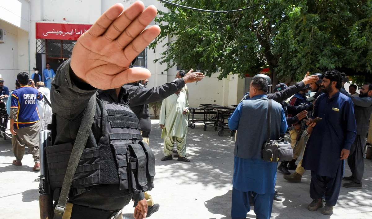 Policemen impede the media as injured security personnel arrive at a hospital in Quetta on April 15, 2025. (AFP/File)
