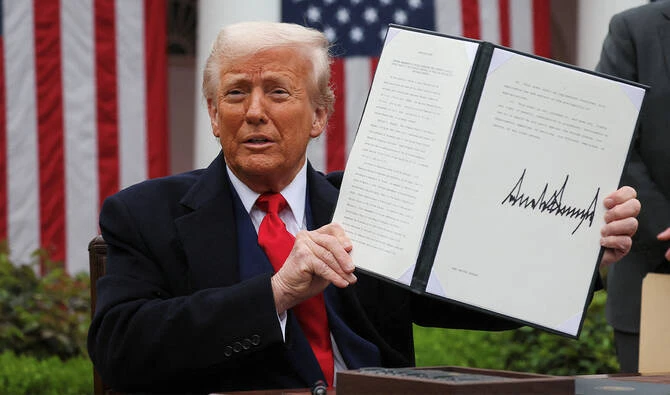 US President Donald Trump holds a signed executive order on tariffs, in the Rose Garden at the White House in Washington, DC, US, April 2, 2025. (REUTERS/File)