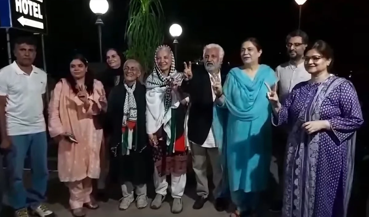 Human rights activists Tahira Abdullah (fourth left) and Samina Khan (center) pose for a group photo, after their release from police custody in Islamabad, Pakistan, on May 30, 2025. (Photo Courtesy: X/@imranakomal)