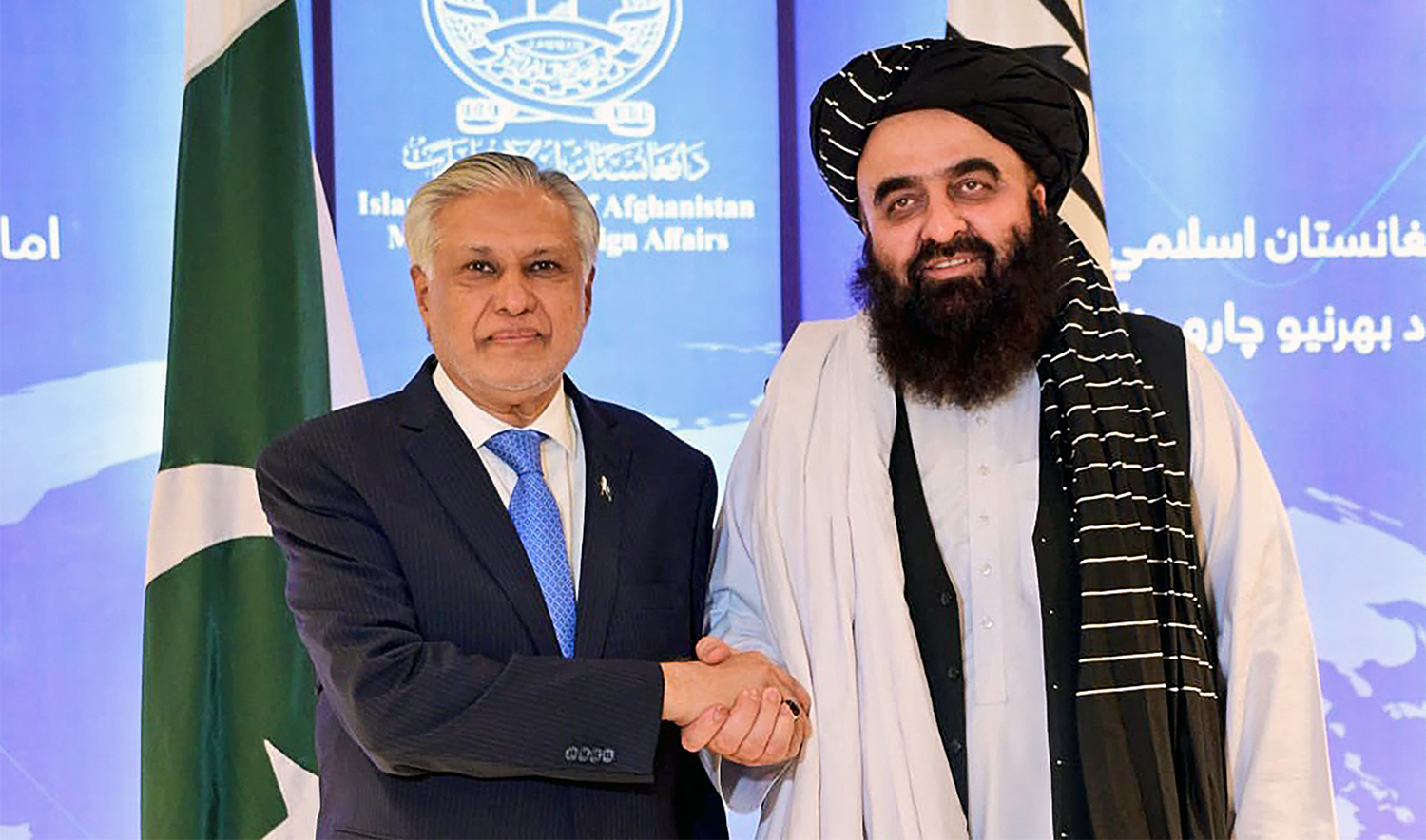 This handout photograph taken on April 19, 2025 and released by the Pakistan's Ministry of Foreign Affairs shows the country's Foreign Minister Ishaq Dar (L) shaking hands with his Afghanistan counterpart Amir Khan Muttaqi during a bilateral meeting in Kabul. (Pakistan's Ministry of Foreign Affairs / AFP)