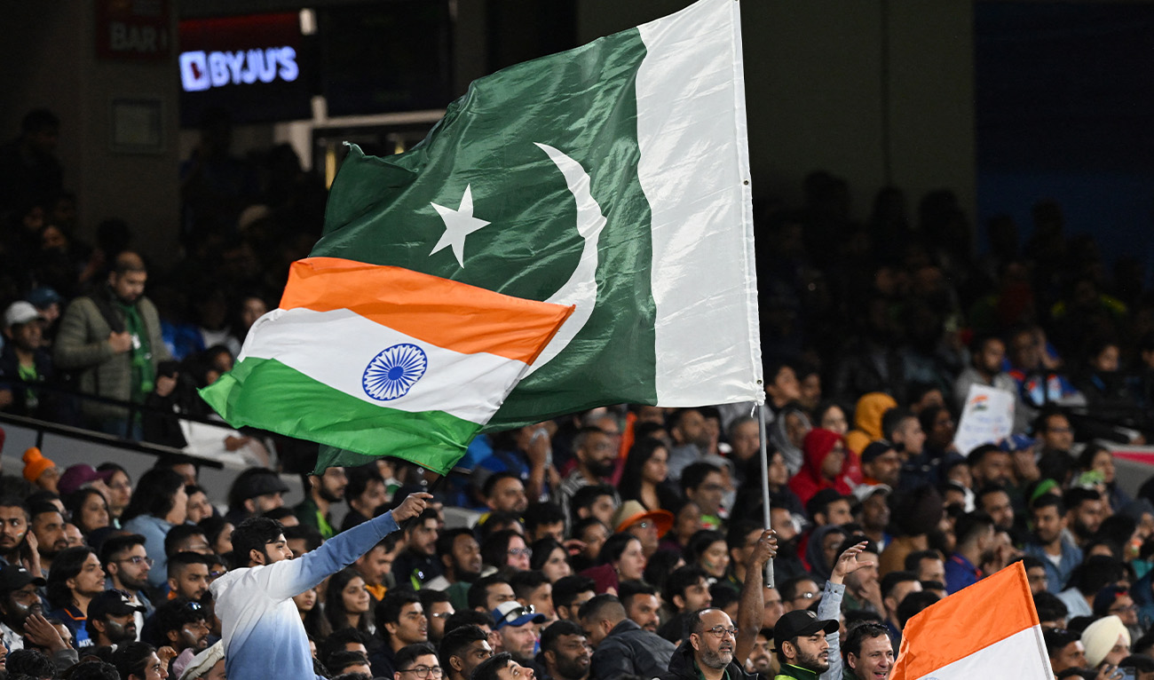 Pakistan and Indian fans wave their national flags during the ICC men's Twenty20 World Cup 2022 cricket match between India and Pakistan at Melbourne Cricket Ground (MCG) in Melbourne on October 23, 2022. (AFP/File)