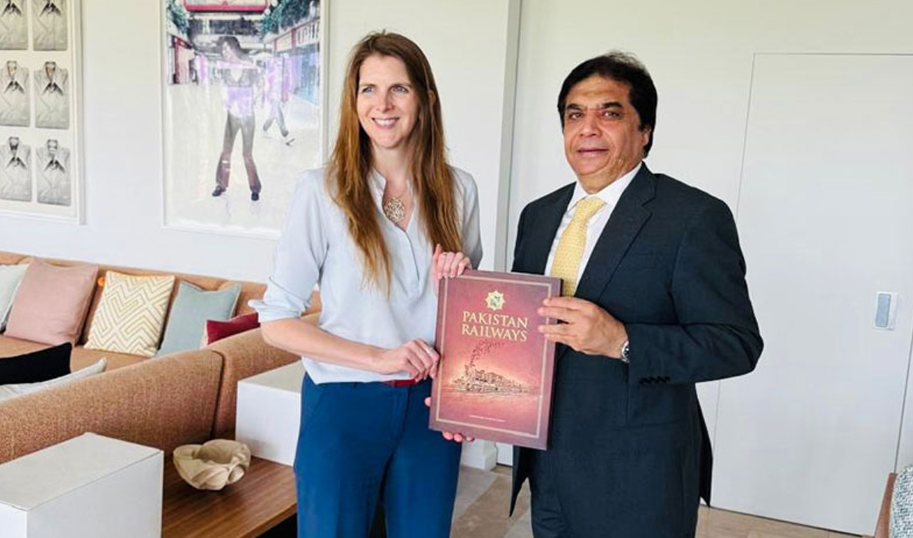 Pakistan Railways Minister Hanif Abbasi and British High Commissioner to Pakistan Jane Marriott gesture for a photo following a meeting in Islamabad on June 4, 2025. (Radio Pakistan)