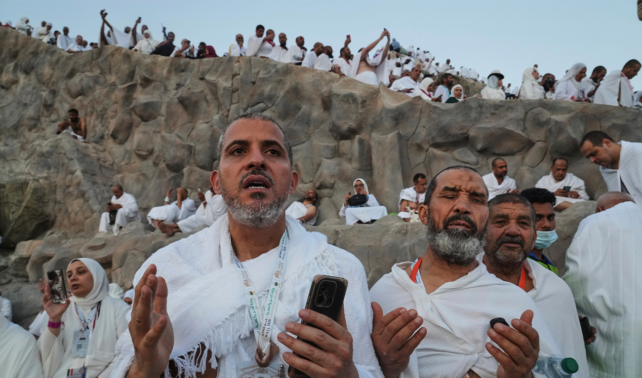 Muslim pilgrims offer prayers at top of the rocky hill known as the Mountain of Mercy, on the Plain of Arafat, during the annual Hajj pilgrimage near the holy city of Makkah, Saudi Arabia, on June 5, 2025. (AP)