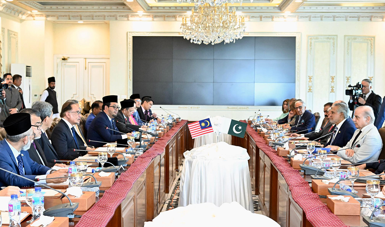 In this file photo, taken and released by Pakistan Prime Minister Office on October 3, 2024, Pakistan Prime Minister Shehbaz Sharif (right) holds delegation level talks with his Malaysian counterpart, Seri Anwar Ibrahim (4L), in Islamabad. (Photo courtesy: PMO/File)