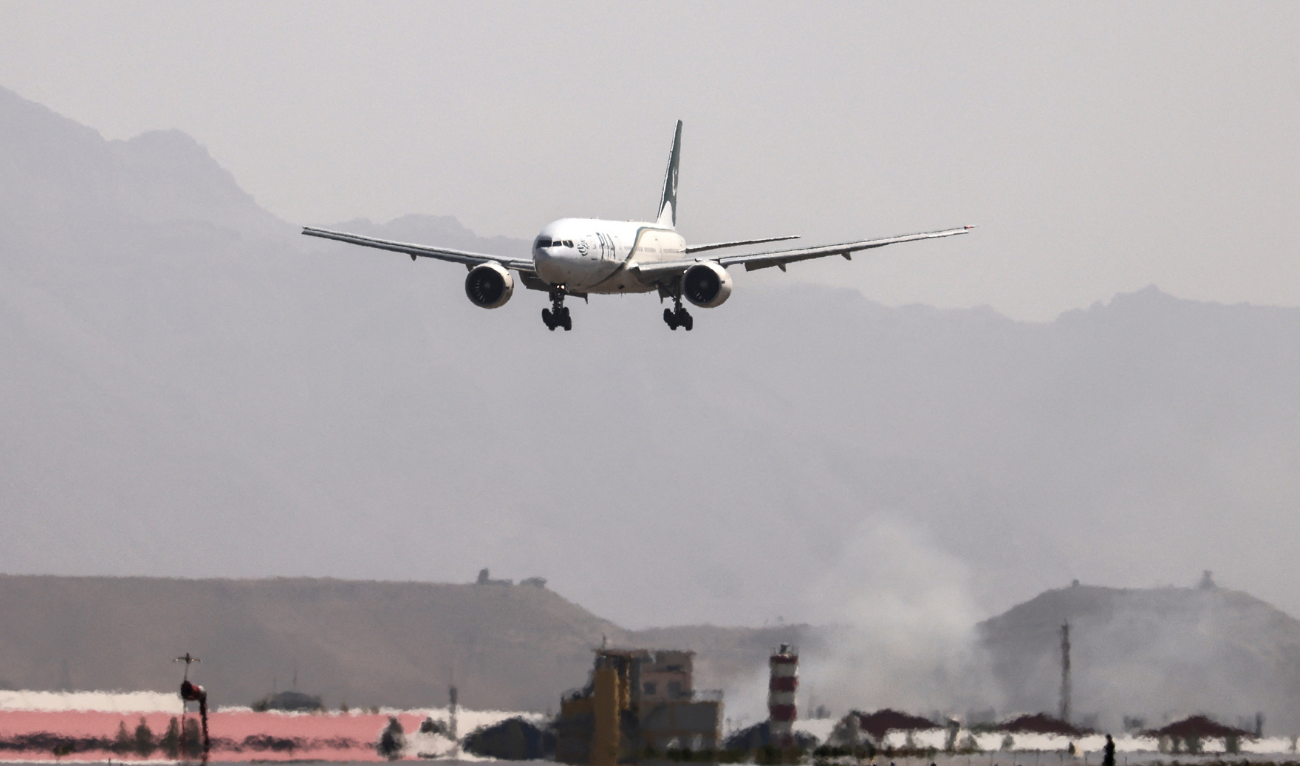 A Pakistan International Airlines plane carrying a handful of passengers, which is the first international commercial flight to land since the Taliban retook power in Afghanistan on August 15, lands at the airport in Kabul, on September 13, 2021. (AFP/file)