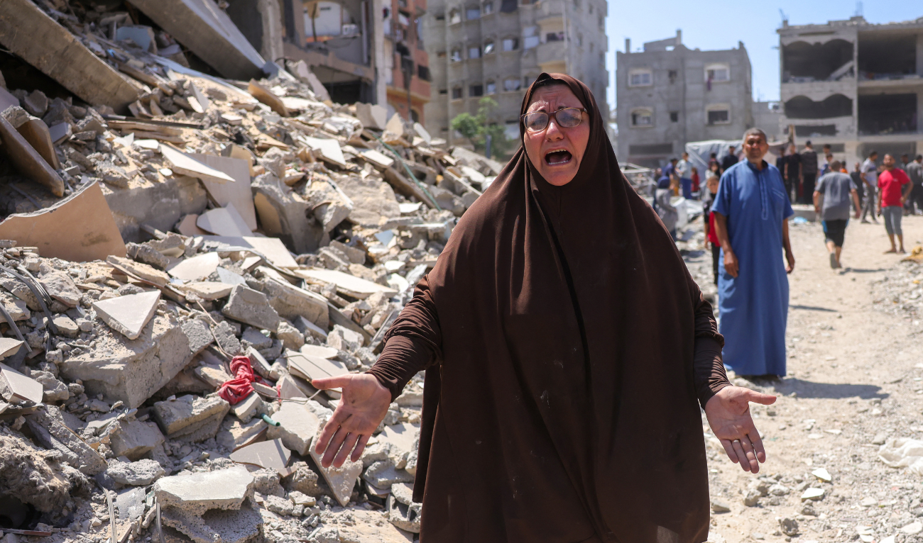 A Palsetinian woman reacts next to the rubble of the Shaheen family home, in the Saftawi neighbourhood, west of Jabalia, in the northern Gaza Strip, after it was targeted in an Israeli strike on June 9, 2025. (AFP)