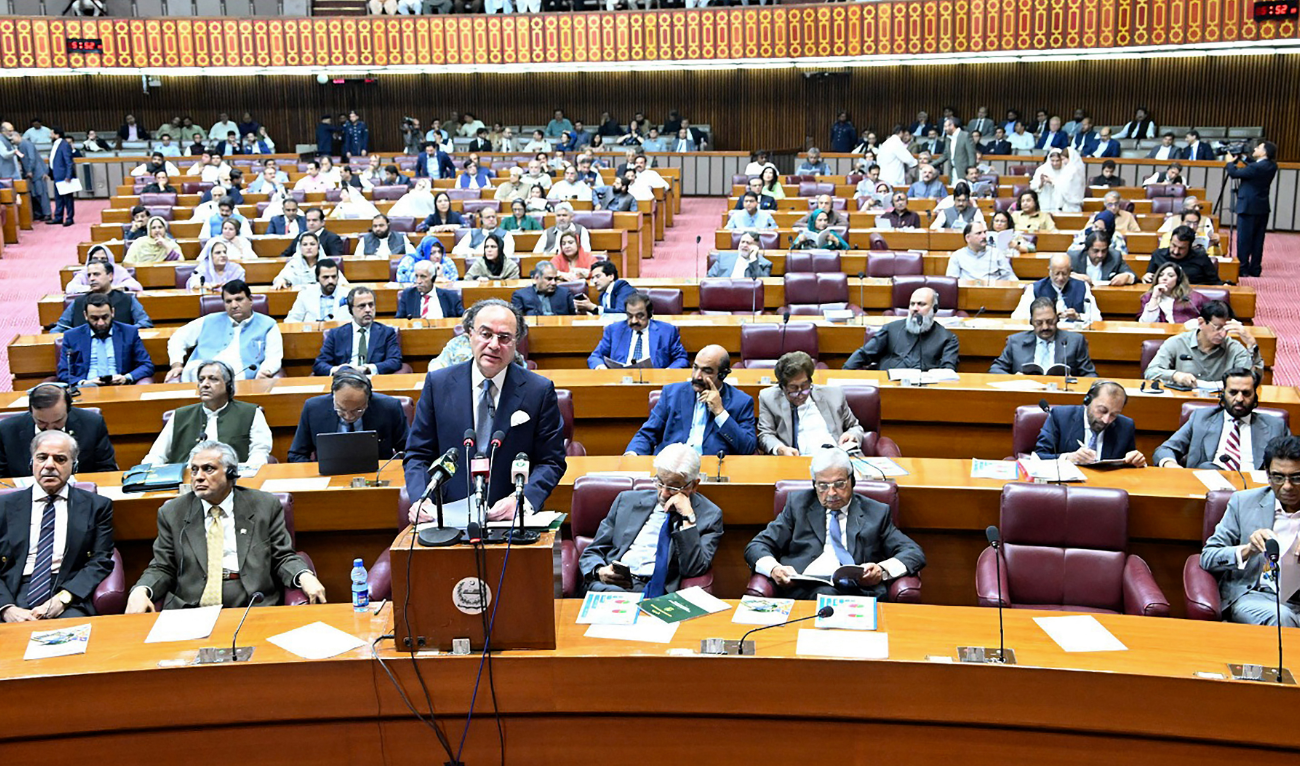 This handout photograph taken on June 10, 2025, and released by Pakistan's National Assembly shows Finance Minister Muhammad Aurangzeb presenting the 2025–26 fiscal budget at the Parliament House in Islamabad. (AFP)