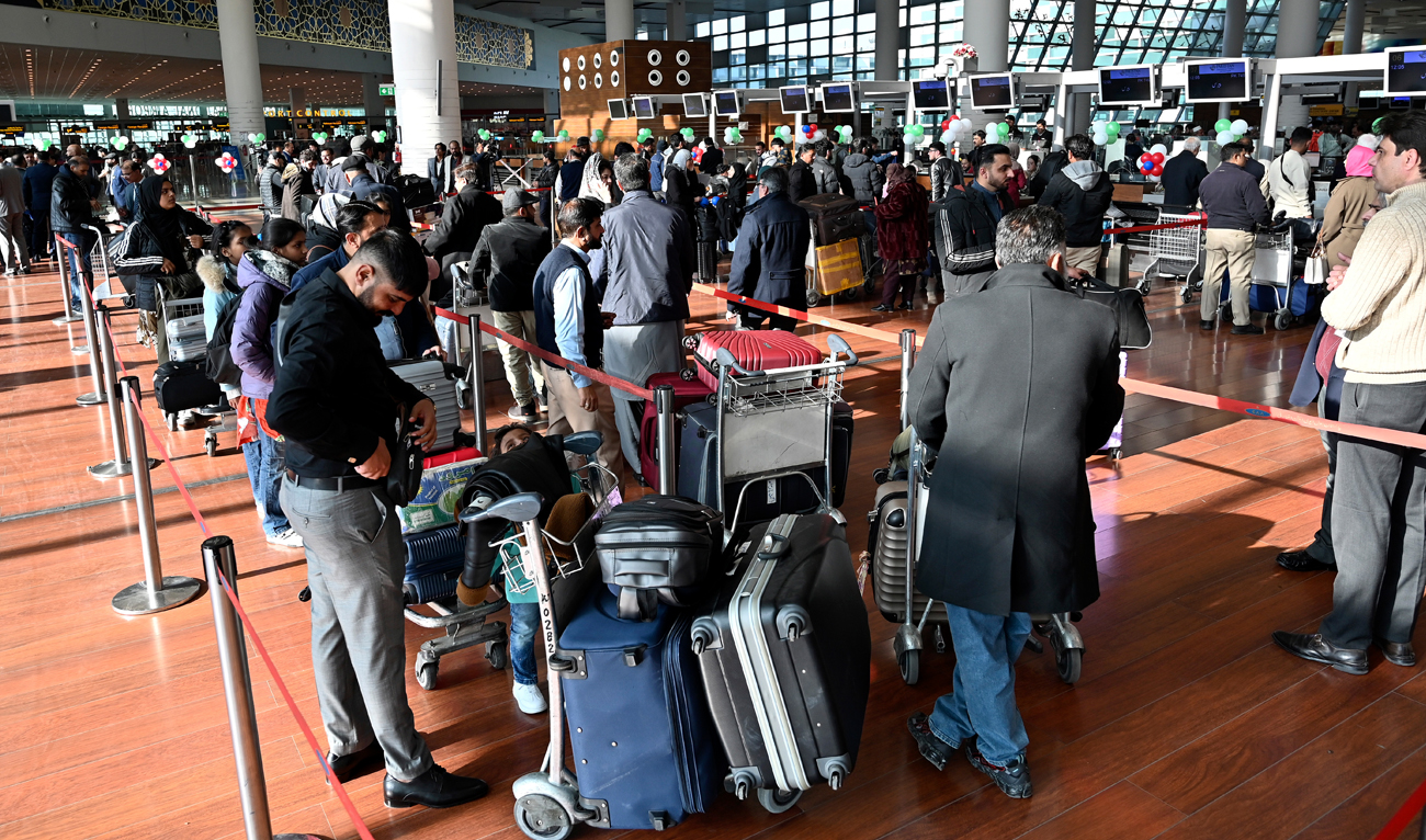 Passengers wait at the immigration counter at the Islamabad International Airport on January 10, 2025. (AFP/File)