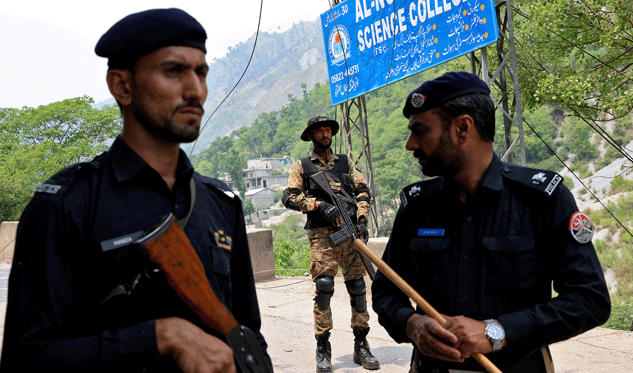 Security force personnel stand guard on a road leading to Bilal Mosque after it was hit by an Indian strike in Muzaffarabad, the capital of Pakistan-administered Kashmir, May 7, 2025. (Reuters/File)