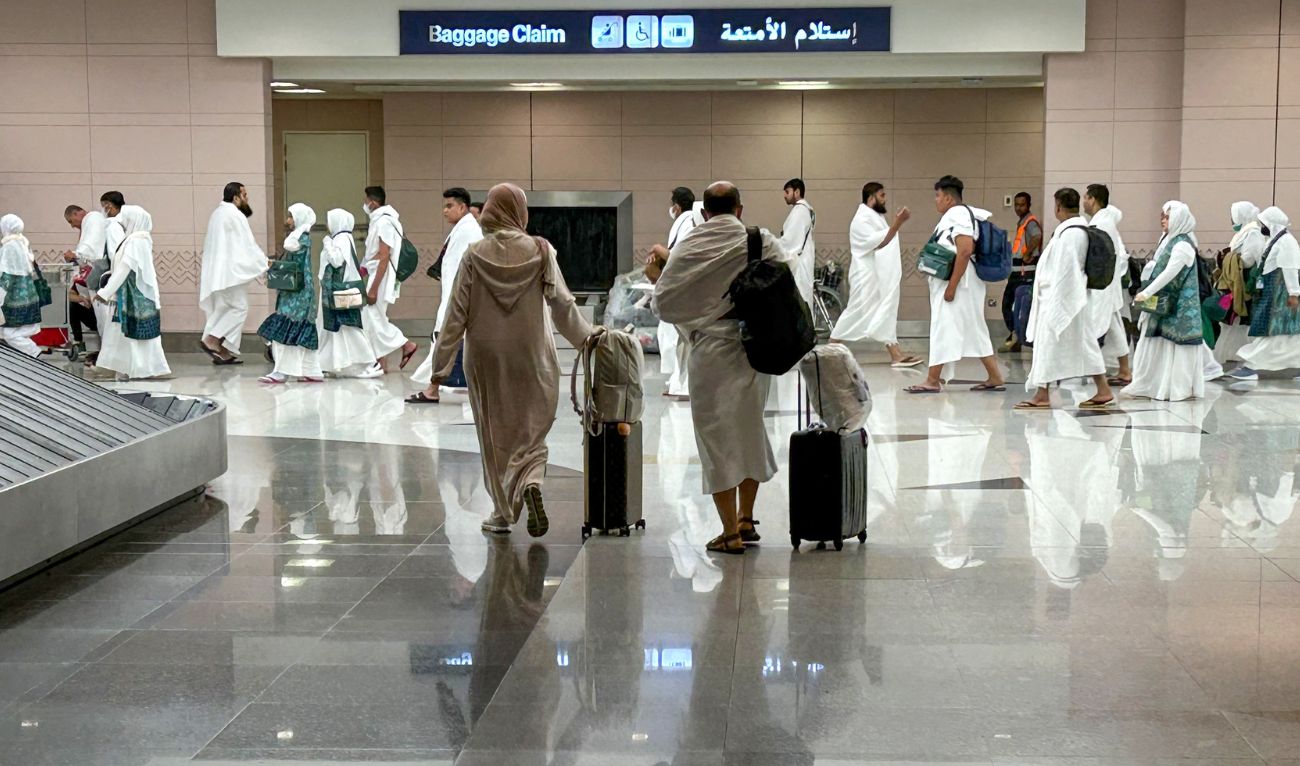 Muslim pilgrims retrieve their luggage as they arrive for the annual Muslim pilgrimage in Mecca, at the Jeddah International Airport on June 10, 2024. (AFP)