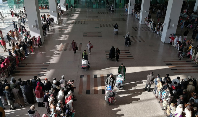 People gather to receive arriving passengers at the international arrival area of the Islamabad International Airport in Islamabad, Pakistan on February 3, 2020. (AFP/File)