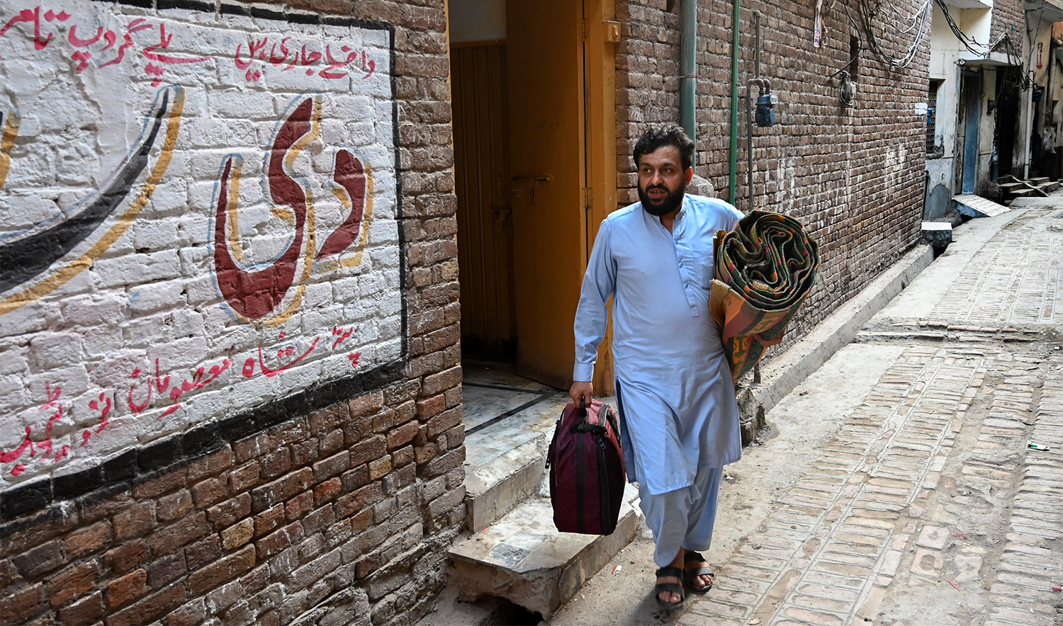 An Afghan refugee vacates his house as he prepares to depart for Afghanistan, in Peshawar on October 31, 2023. (AFP/File)
