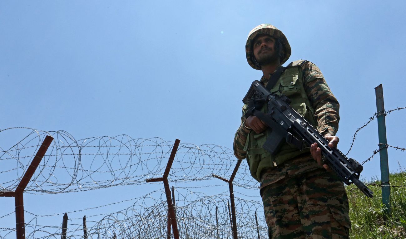 An Indian army soldier stands guard at the Line of Control (LoC) between Pakistan and India, in Poonch sector of India's Jammu region, on May 20, 2025. (AFP)