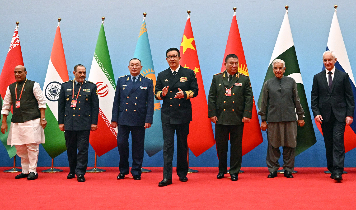 (L-R) India's Defence Minister Rajnath Singh, Iran's Defence Minister Amir Nasirzadeh, Kazakhstan's Defence Minister Dauren Kossanov, China's Defence Minister Dong Jun, Kyrgyzstan's Defence Minister Ruslan Mukambetov, Pakistan's Defence Minister Khawaja Muhammad Asif, and Russia's Defence Minister Andrei Belousov gather for a group photo during the Defence Ministers' Meeting of the Shanghai Cooperation Organization (SCO) Member States in Qingdao, in eastern China's Shandong province on June 26, 2025. (AFP)