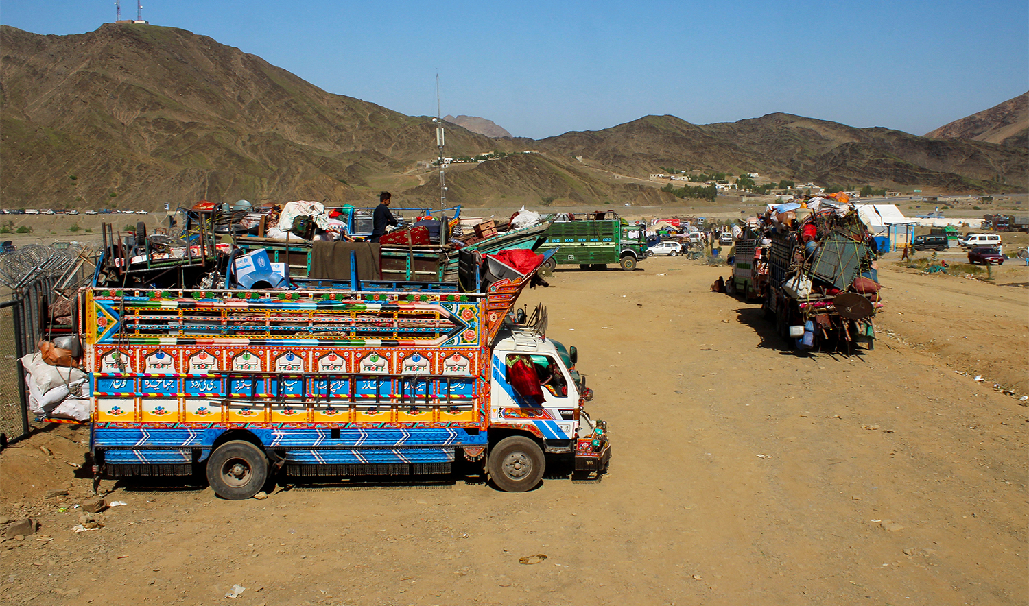 Afghan nationals, who were expelled from Pakistan, stand in queue for registration upon their arrival at the Omari refugee camp in Mohmand Dara, Torkham border, Nangarhar province, Afghanistan, on April 15, 2025. (REUTERS/File)