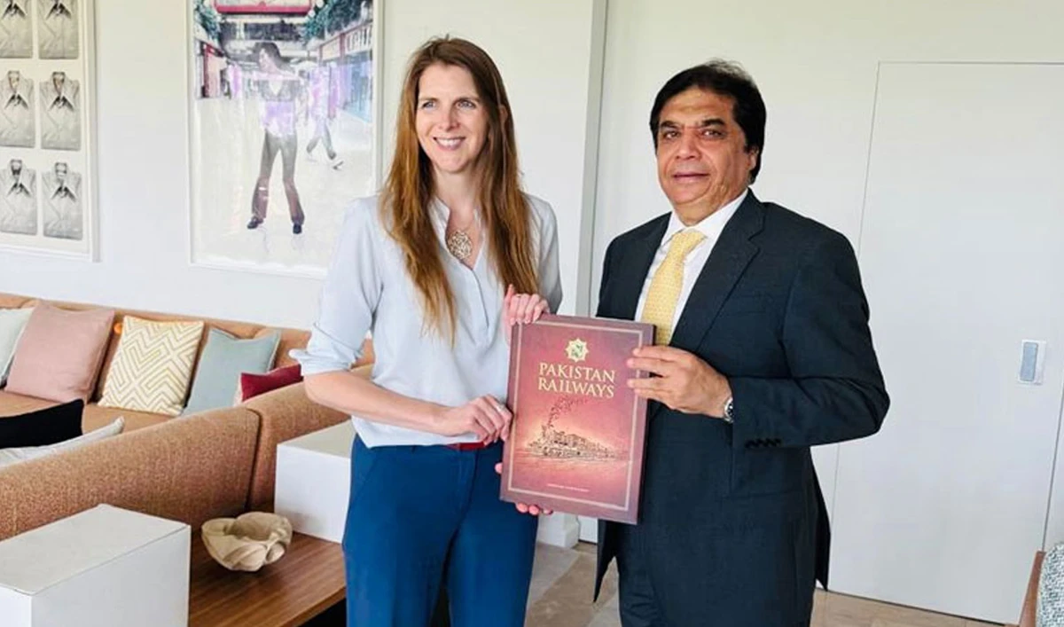 Pakistan Railways Minister Hanif Abbasi and British High Commissioner to Pakistan Jane Marriott gesture for a photo following a meeting in Islamabad on June 4, 2025. (Radio Pakistan)