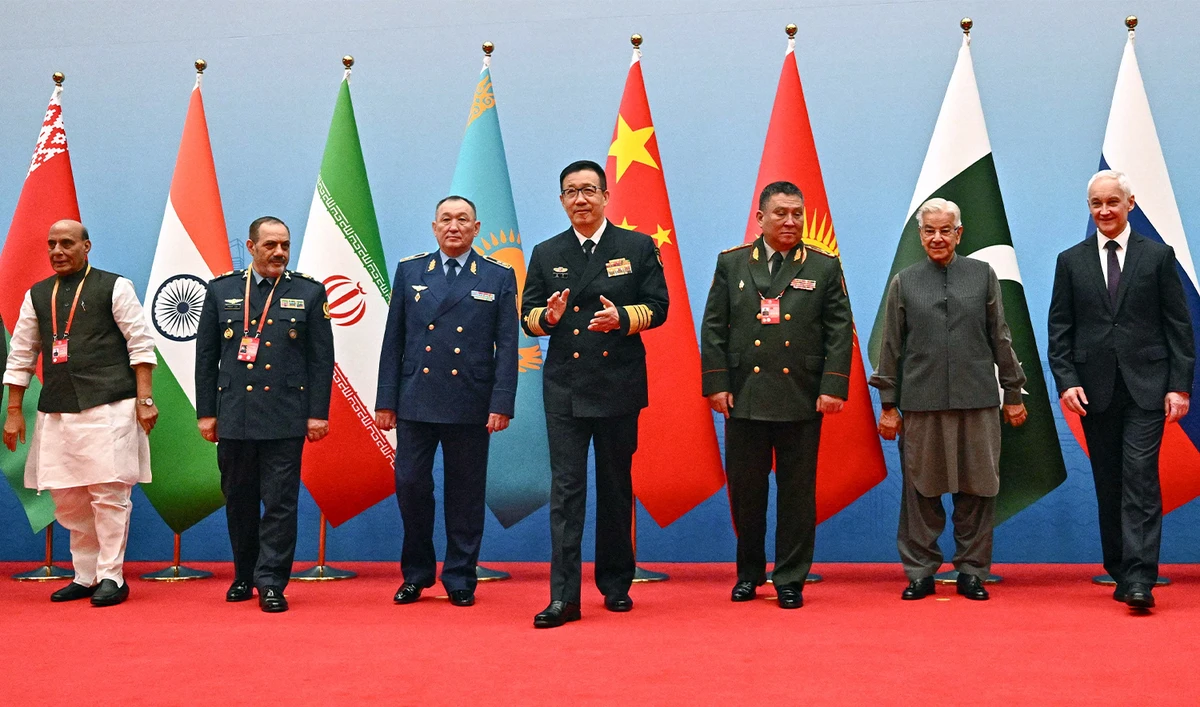 (L-R) India's Defence Minister Rajnath Singh, Iran's Defence Minister Amir Nasirzadeh, Kazakhstan's Defence Minister Dauren Kossanov, China's Defence Minister Dong Jun, Kyrgyzstan's Defence Minister Ruslan Mukambetov, Pakistan's Defence Minister Khawaja Muhammad Asif, and Russia's Defence Minister Andrei Belousov gather for a group photo during the Defence Ministers' Meeting of the Shanghai Cooperation Organization (SCO) Member States in Qingdao, in eastern China's Shandong province on June 26, 2025. (AFP)