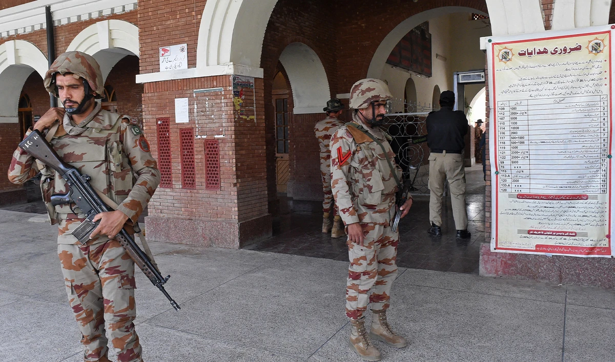 Paramilitary soldiers stand guard at a railway station in the Sibi district of southwestern Balochistan province on March 12, 2025, during a security operation against militants a day after they hijacked a passenger train. (AFP/File)
